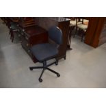 A modern black swivel office chair