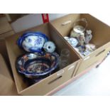 Three boxes containing blue and white china, cheese cover, biscuit barrel, oil lamp, kettle,