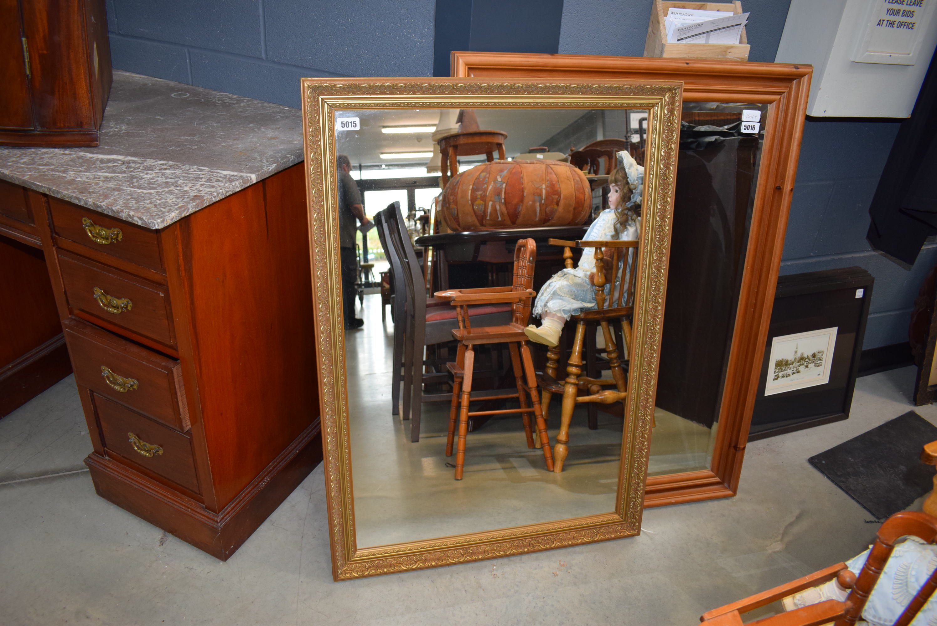 A gilt framed wall mirror