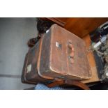 A wooden ribbed canvas travelling trunk