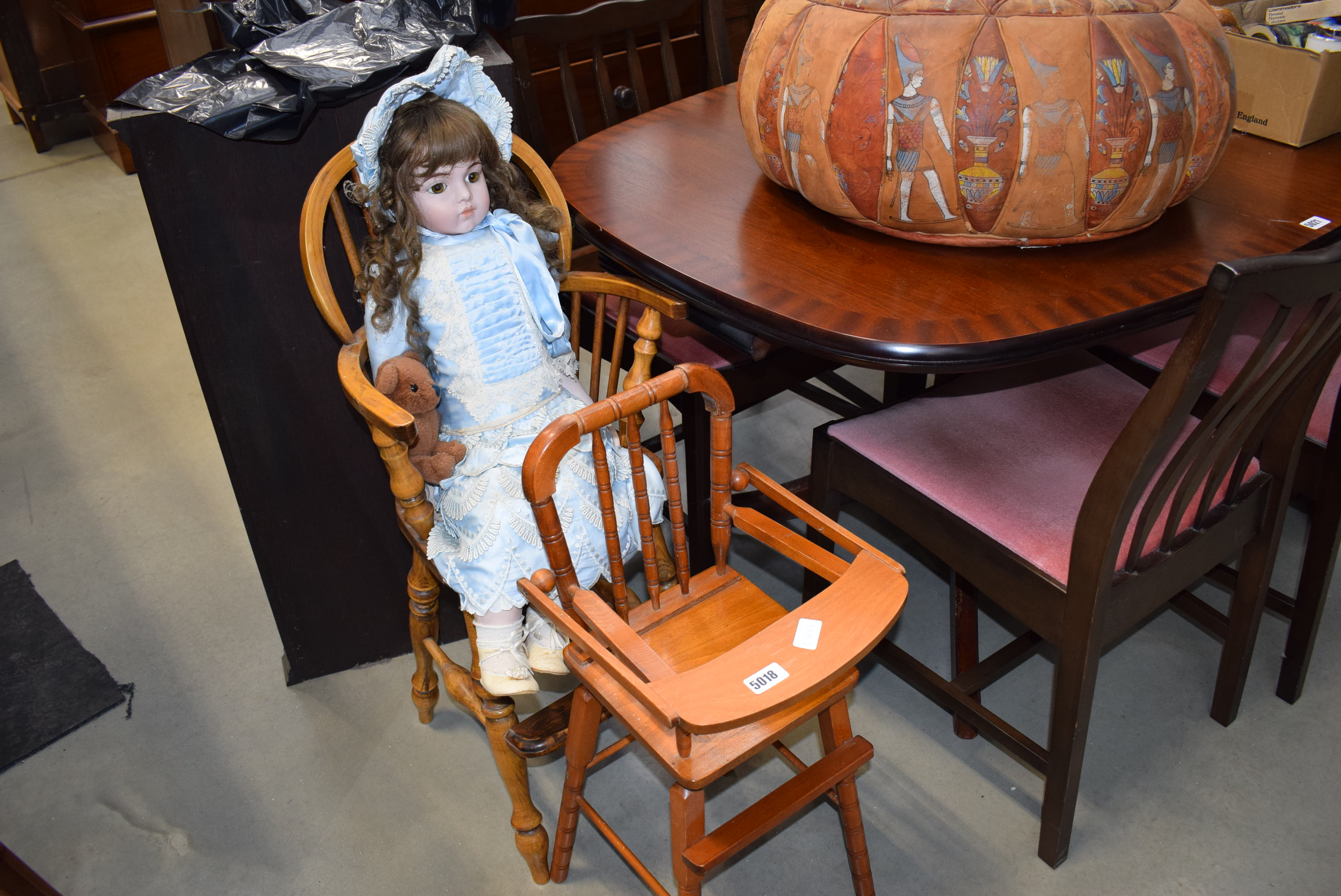 Two dolls high chairs and a modern porcelain headed doll