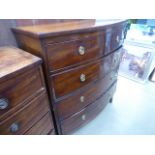 A Victorian bow fronted mahogany chest of two over three drawers