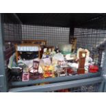 Four cages containing a large quantity of dolls house furniture and accessories