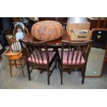 A late 20th/early 21st century mahogany dining table and four chairs and a matching glazed display