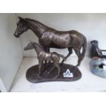 A resin figure mare and foal