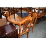 A modern pine kitchen table and four chairs