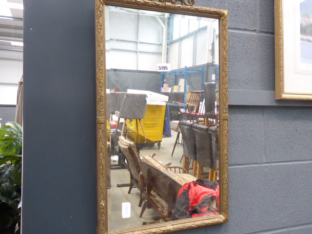 Rectangular bevelled mirror in ornate gilt frame