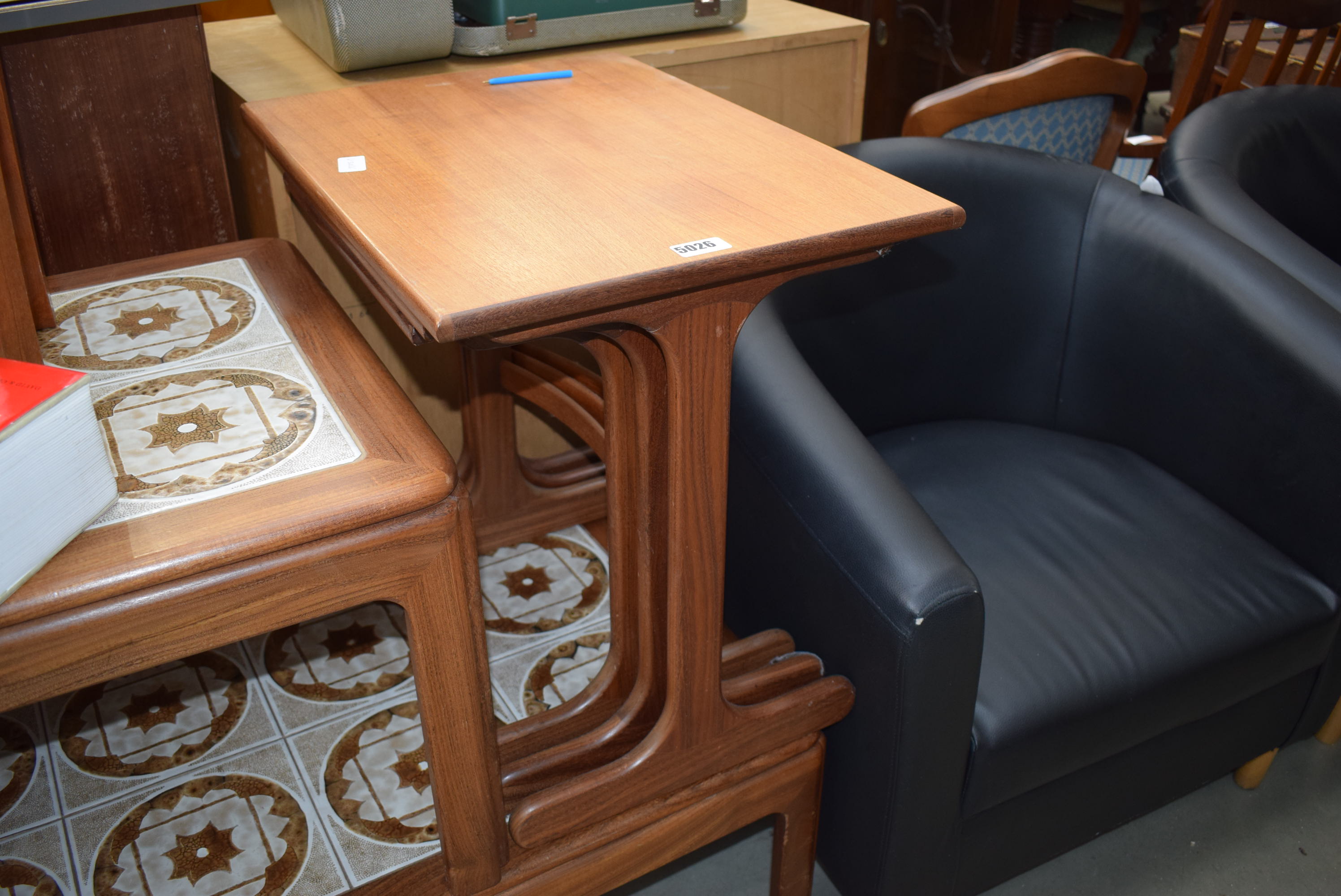 A nest of teak coffee tables