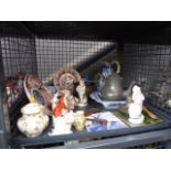 A cage of Staffordshire figures, Delft tile, shells, Imari china, general china,