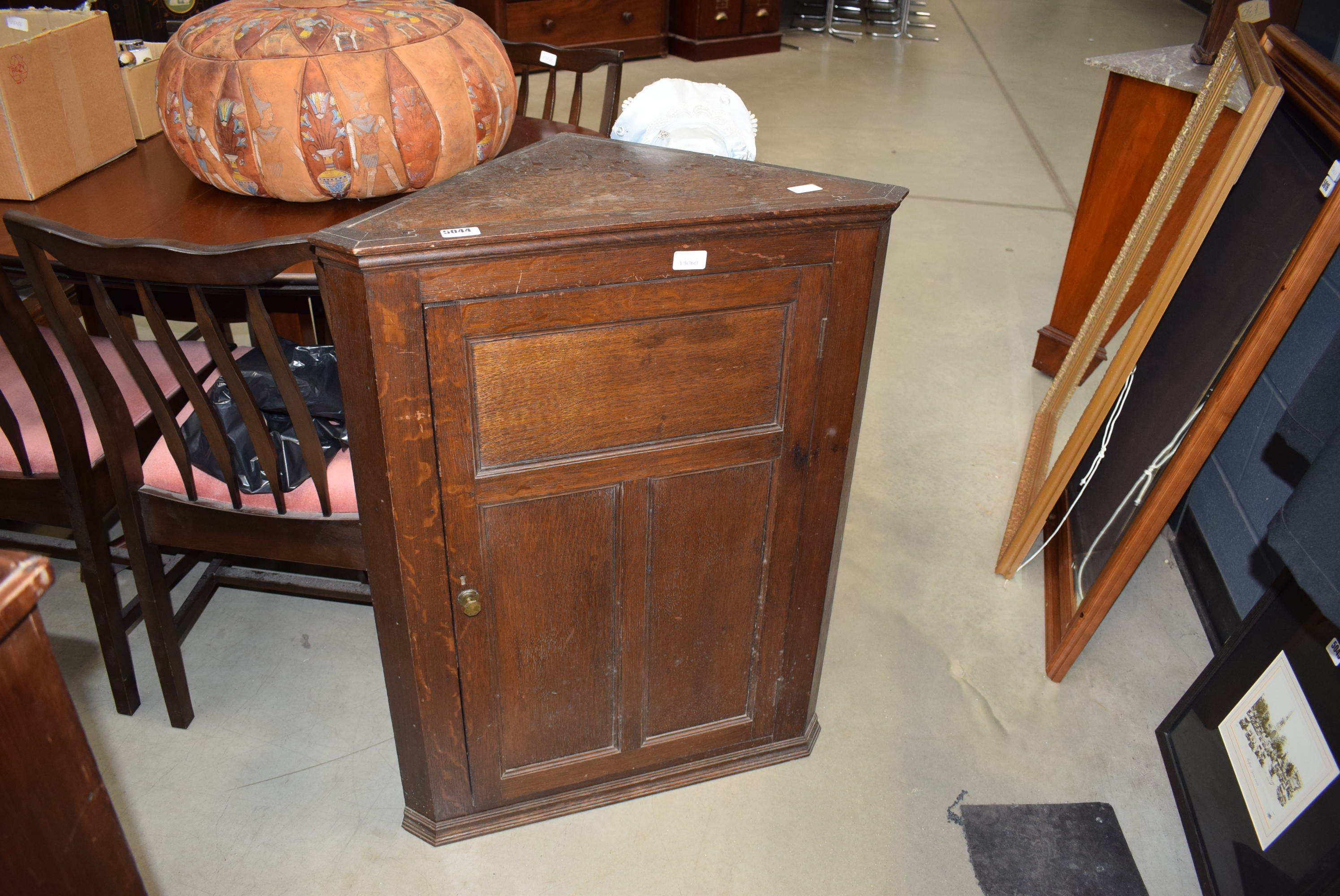 An oak corner cabinet