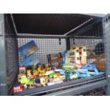 A cage of diecast and other toys