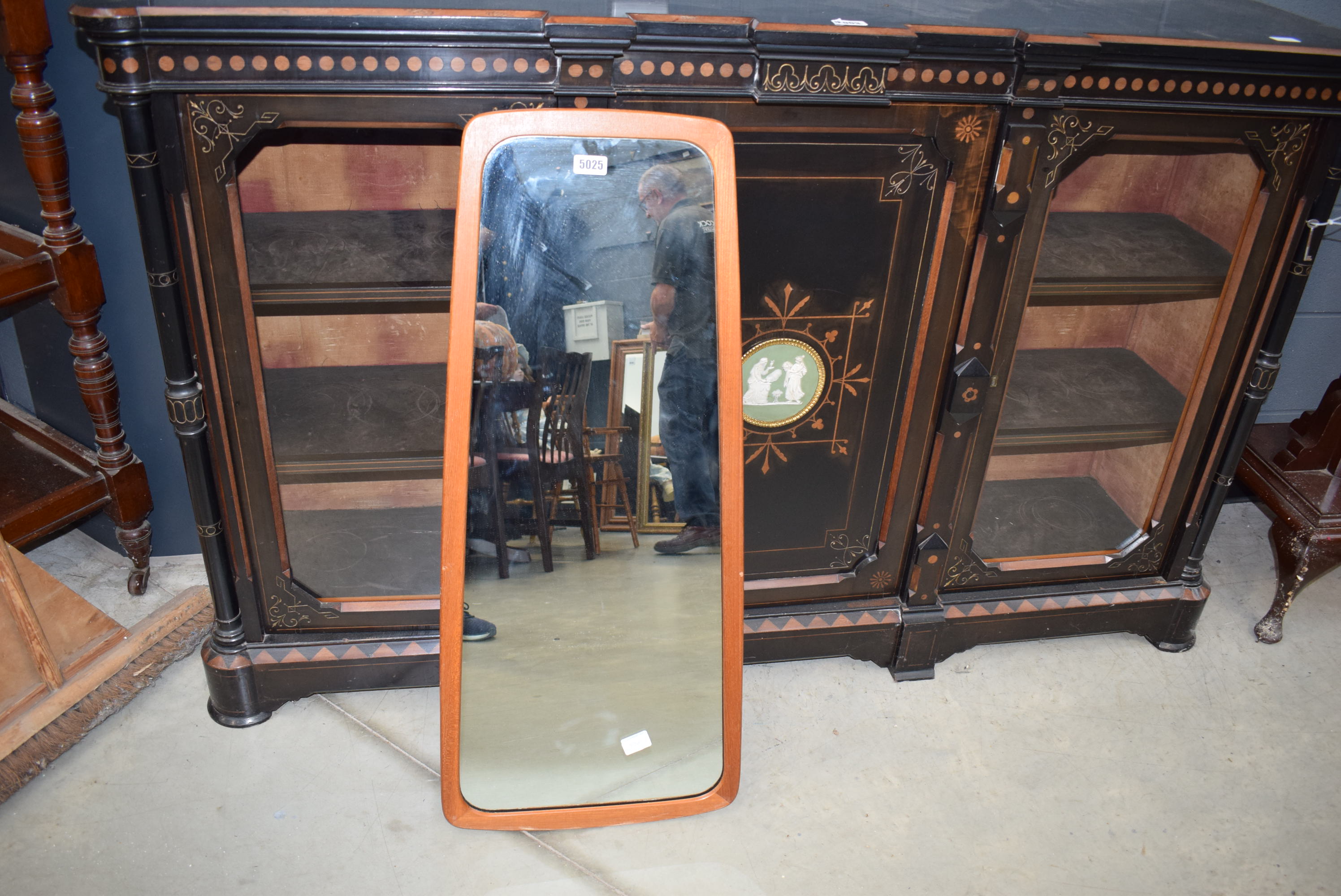 A 1970's teak framed wall mirror