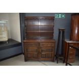 An oak sideboard with plate rack over