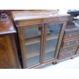 Stained beech bookcase with double glazed doors