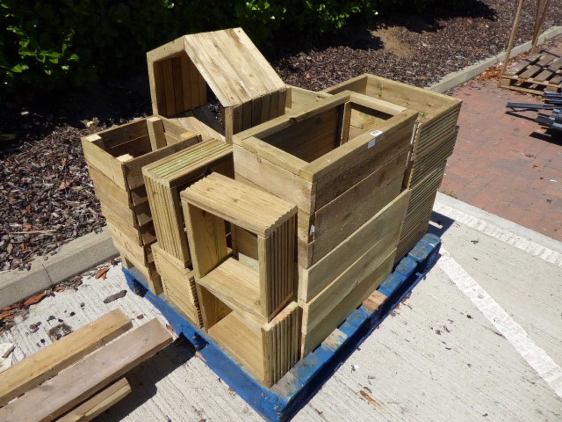 Pallet containing decking board planters