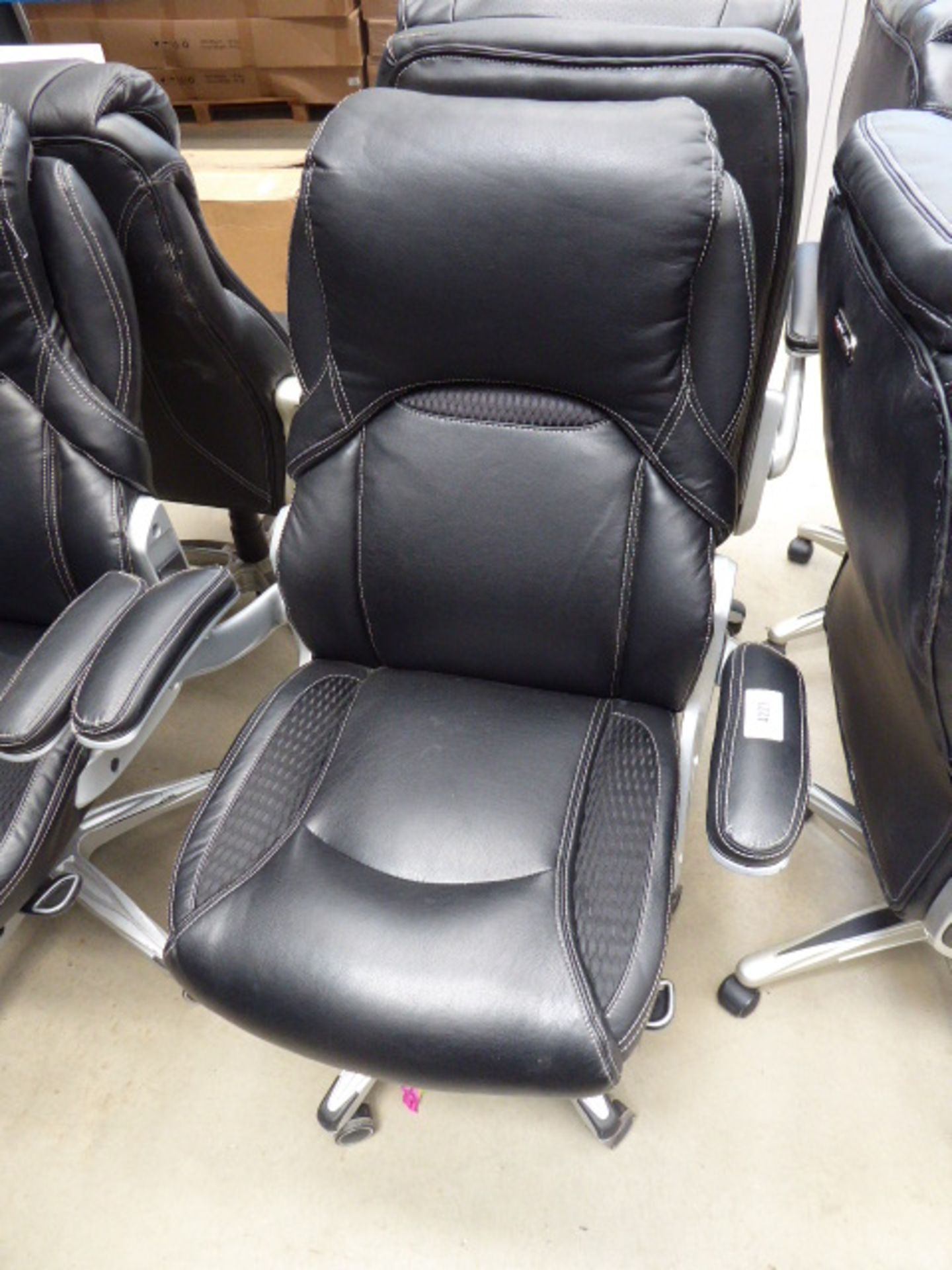 Black high back executive style swivel armchair