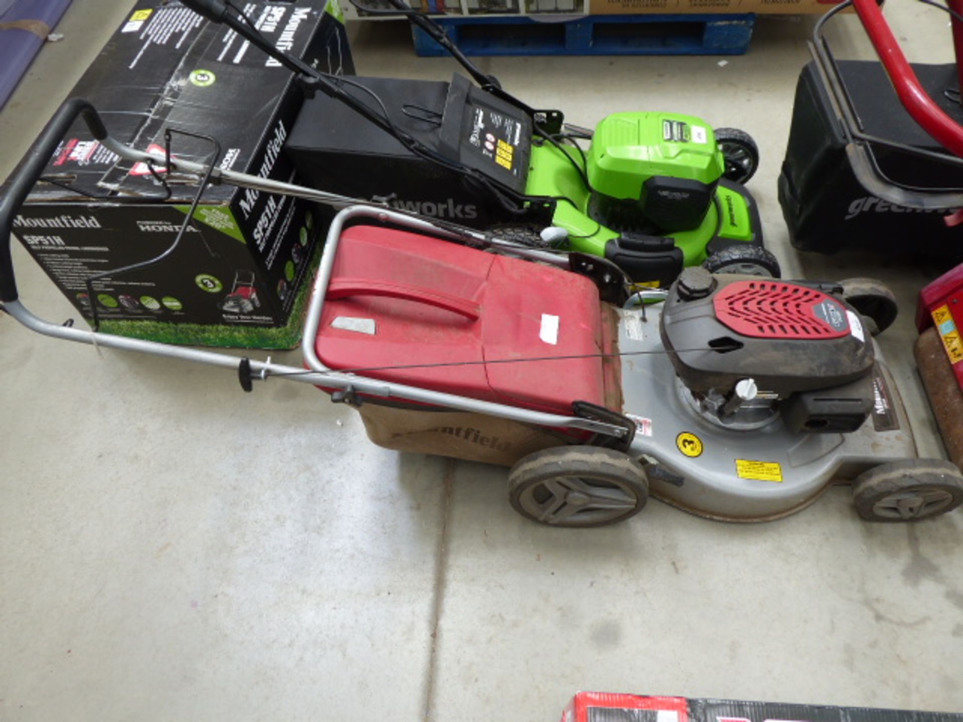 Mountfield silver and red petrol powered rotary mower with grass box