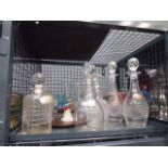 Cage containing decanters and wine glasses