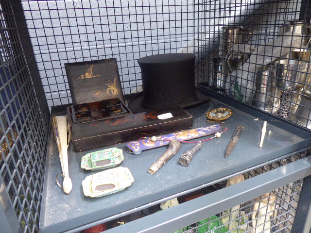 Cage containing a top hat, cloisonne match boxes, fan,