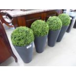 4 artificial box plants in plastic tubs