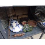 Cage containing figure of a dog, glassware, cheese dish,