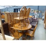 Circular beech table plus 6 stick back chairs