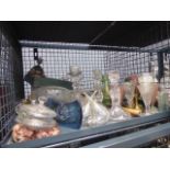 Cage containing glass candlesticks, vases,