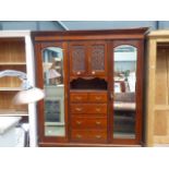 Edwardian compactum with carved panels