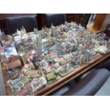 Large quantity of model churches of various makes and sizes with small collection of oval church