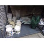 Cage containing glass vases,