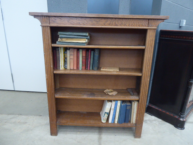 Open bookcase with small quantity of books