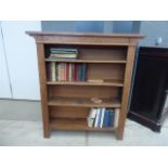 Open bookcase with small quantity of books