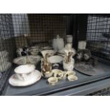 Cage containing a quantity of Greek key patterned china,