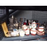 Cage containing silver plate to include candlesticks, goblets plus decanter,