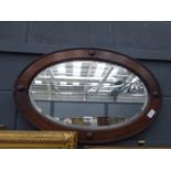 Oval bevelled mirror with oak frame