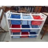 White painted child's toy rack with canvas baskets