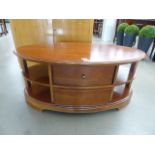 Oval coffee table/TV stand with drawers and shelves
