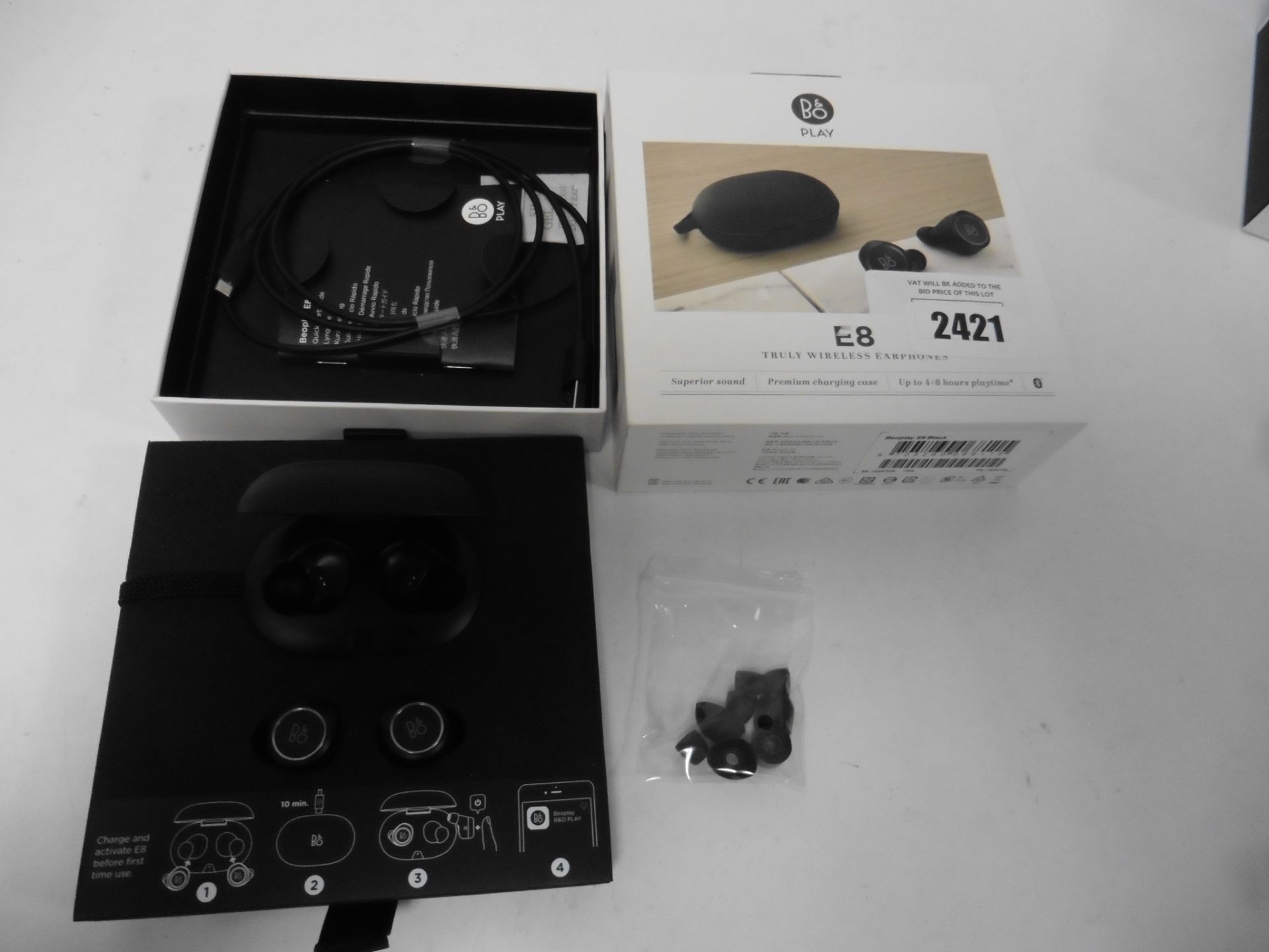 Pair of B&O E8 wireless earphones and box