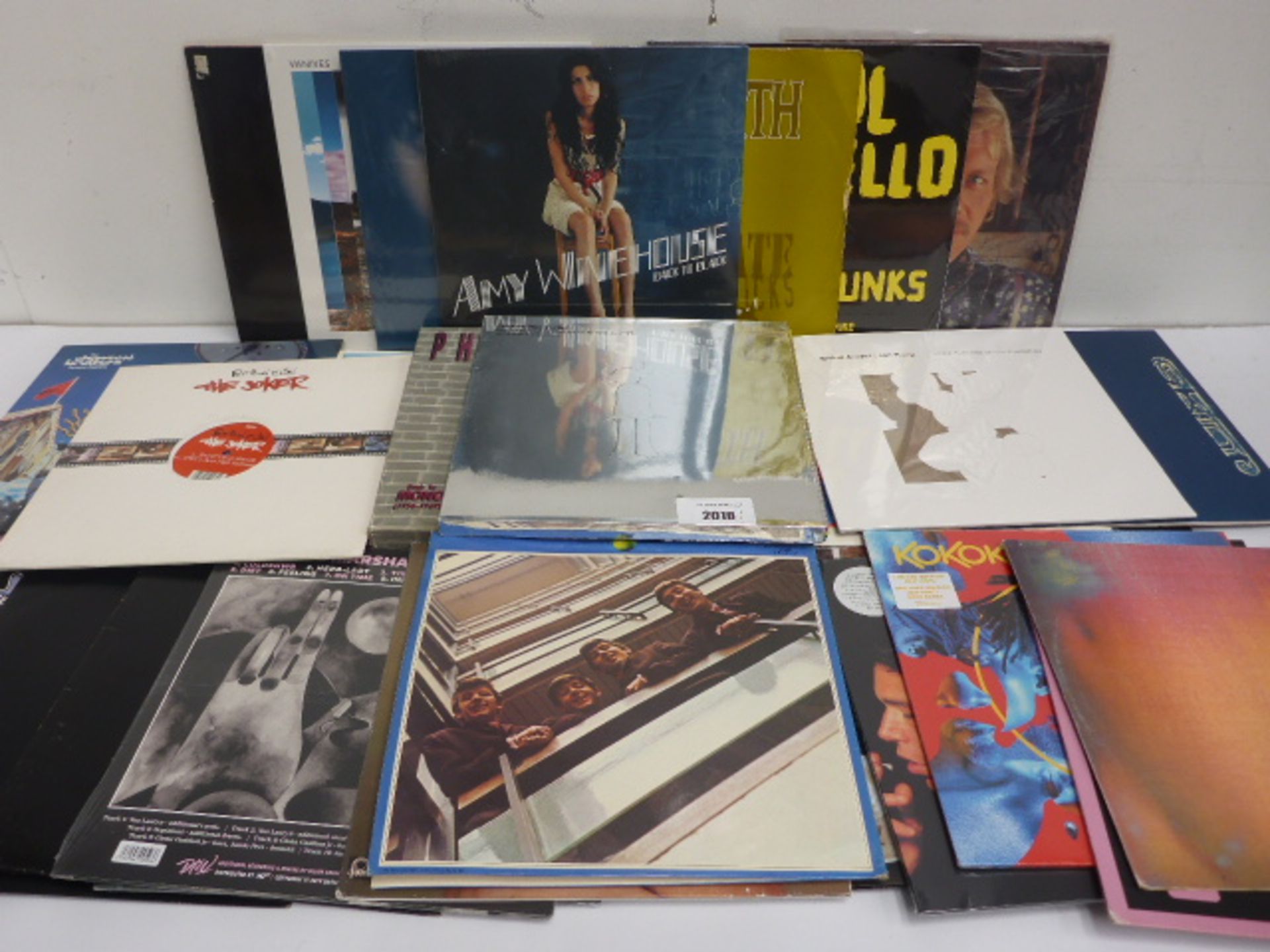 Box containing quantity of LP and 45 records to include Amy Winehouse, Jamiroquai, Beatles, Jane