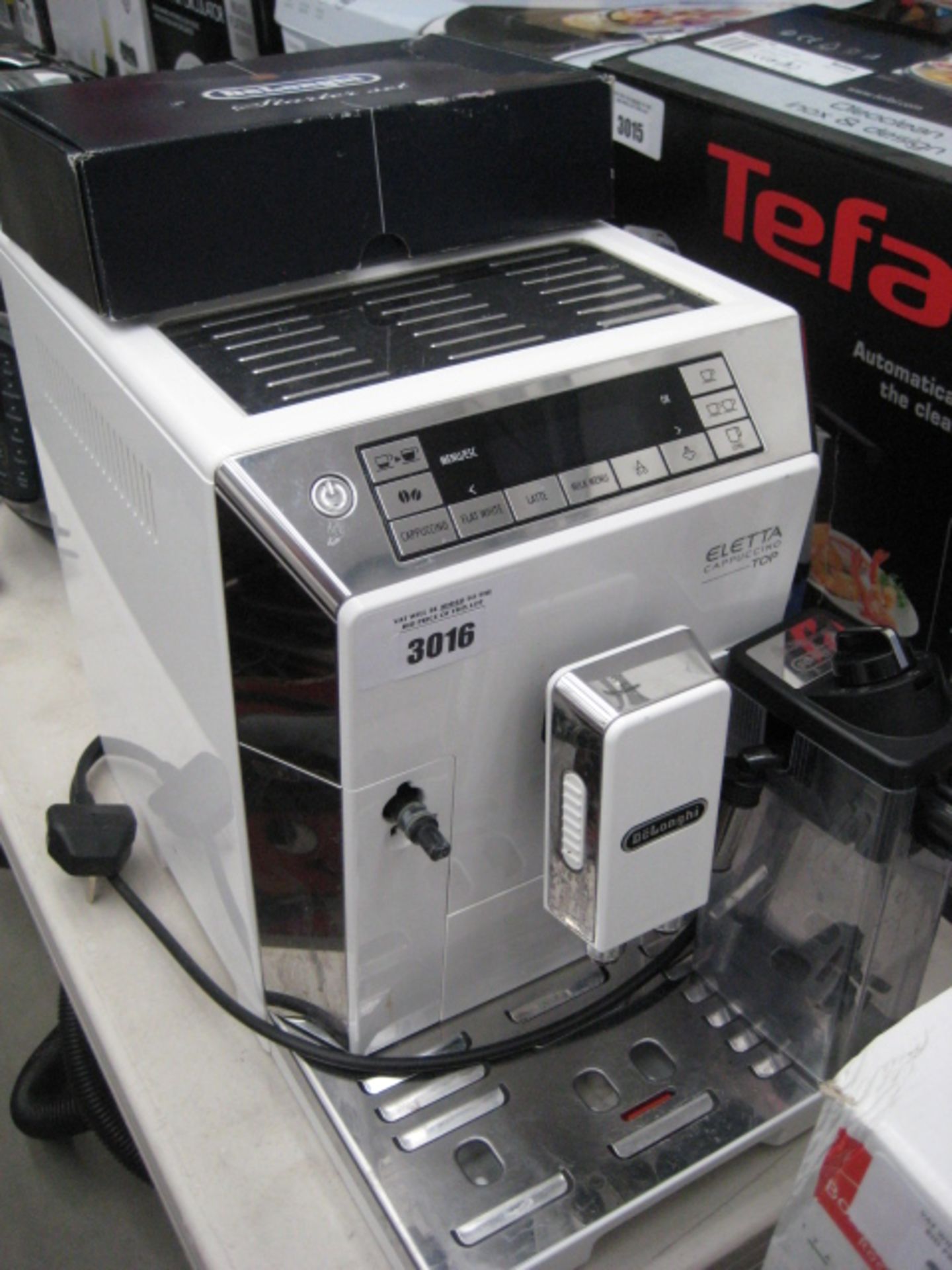 Unboxed Delonghi Eletta cappuccino top coffee dispenser plus Delonghi starter set