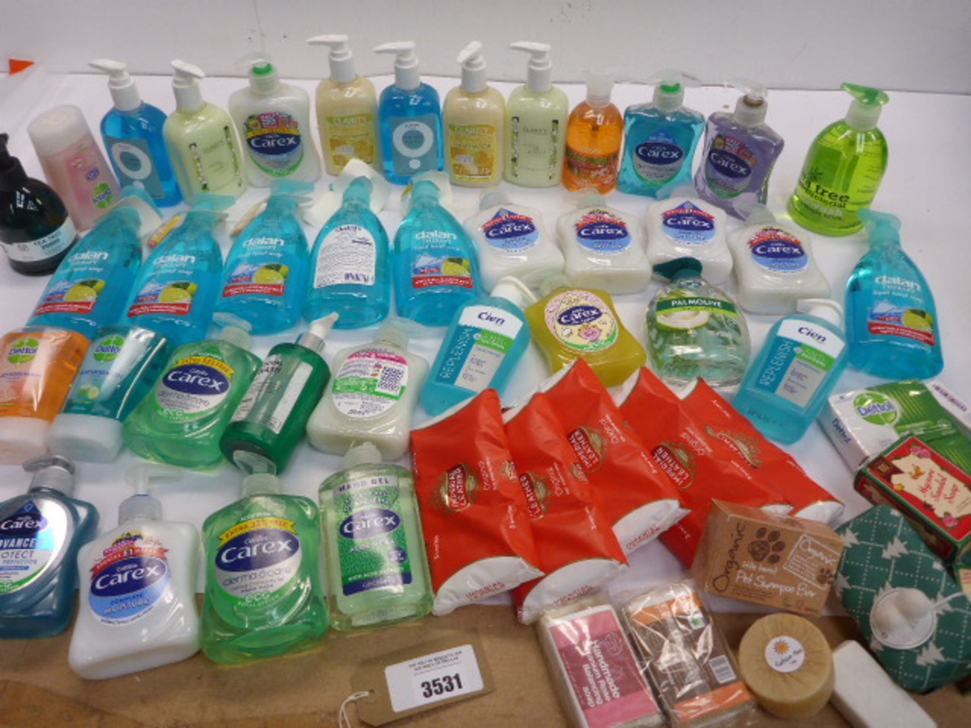 Bag containing Carex and other liquid hand soaps and bars of soap