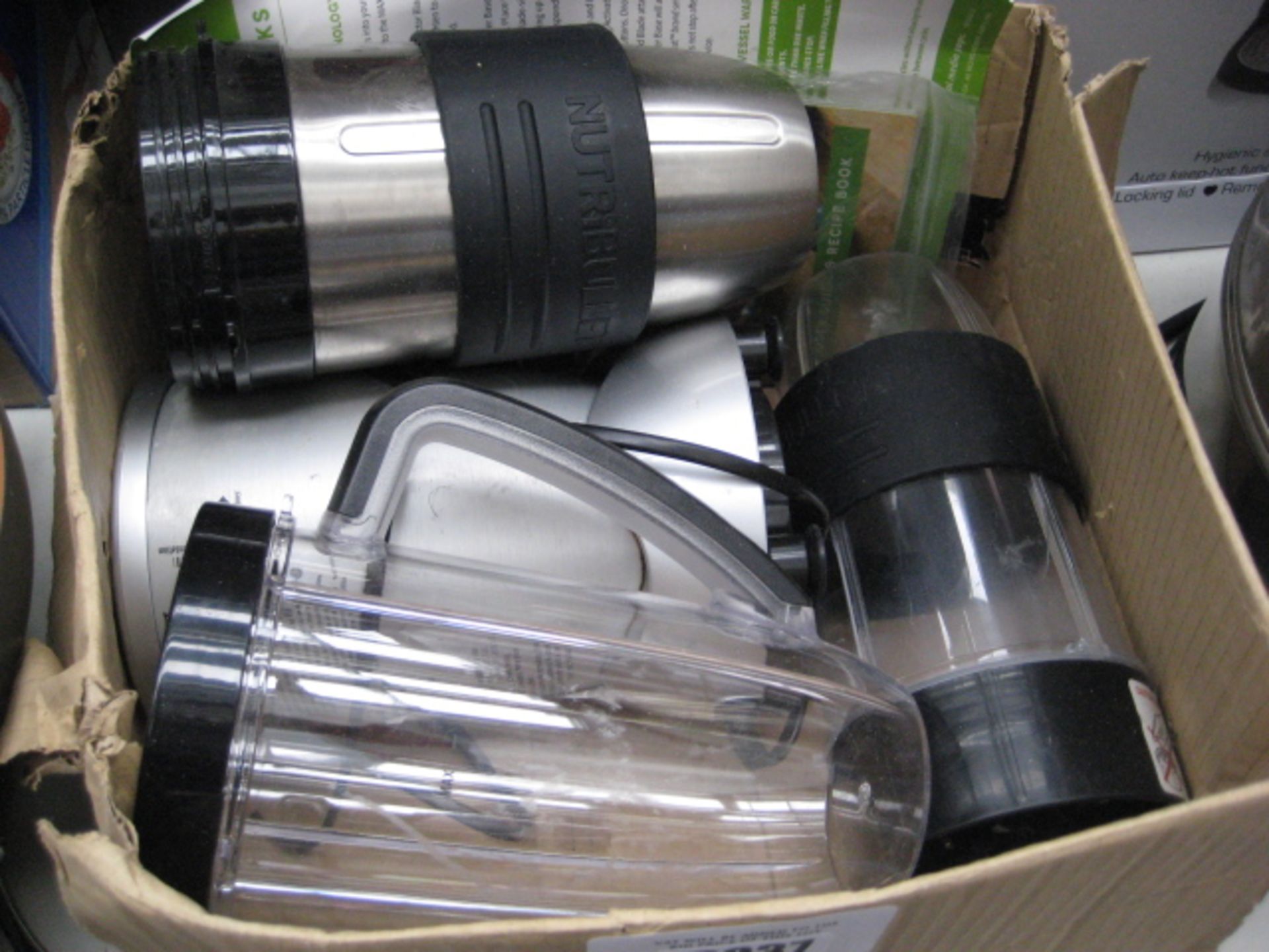 Box containing Nutri Ninja plus 3 attachments