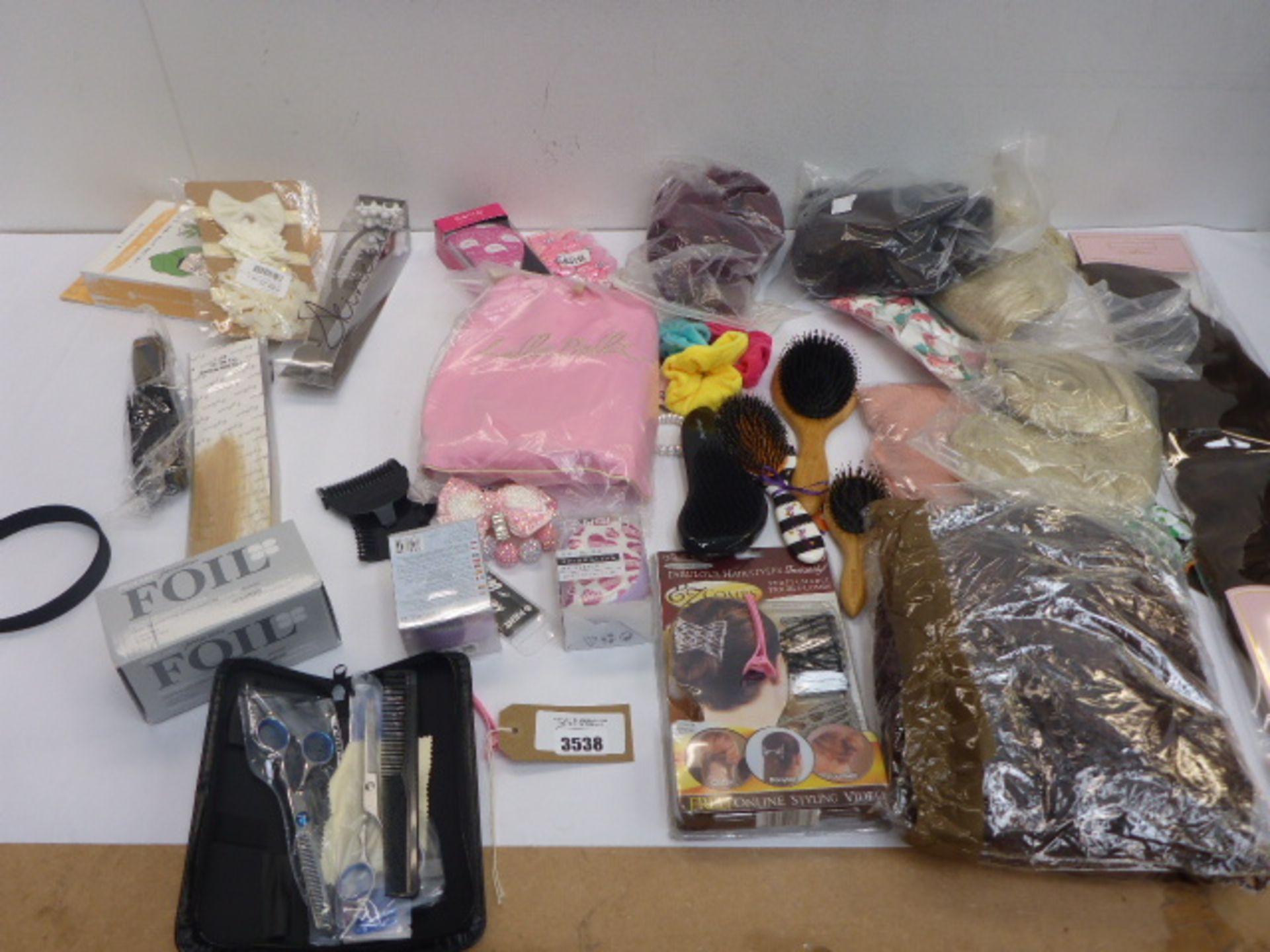 Selection of wigs, hair decorative accessories, hair scissor set, highlighting foils, hair brushes