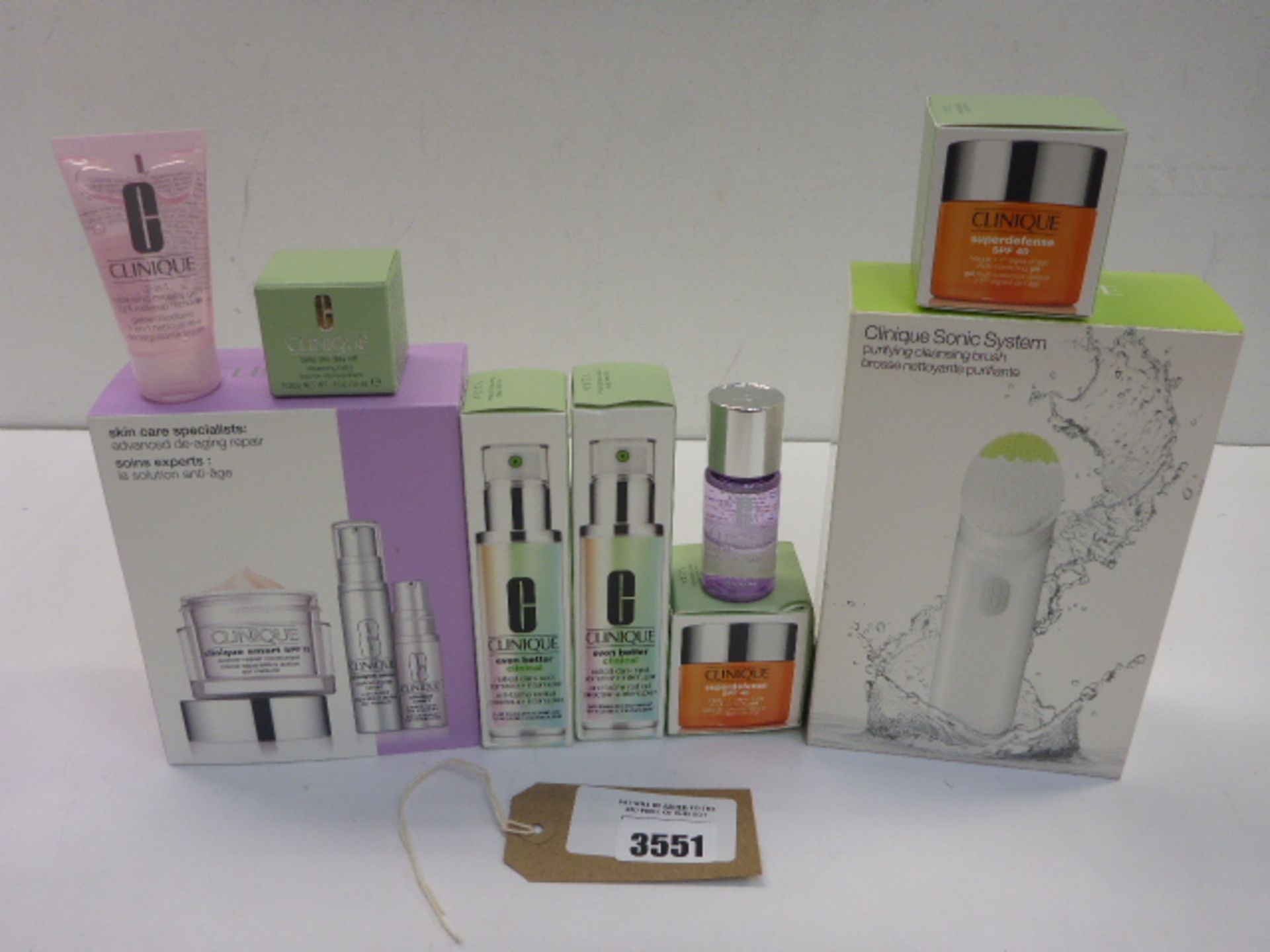 Selection of Clinique beauty products including Purifying cleansing brush, Super Defence SPF 40,