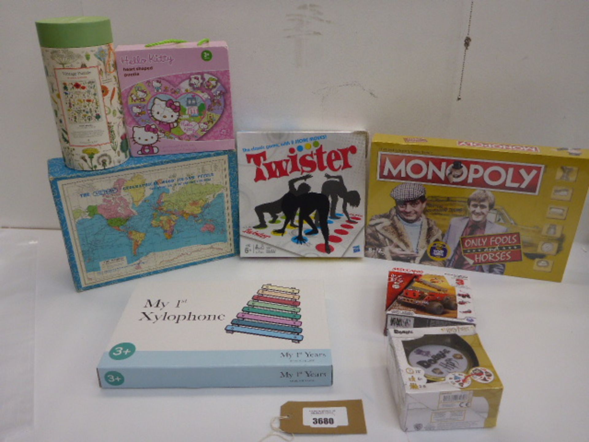 8 boxed games including Monopoly, Twisters, Xylophone, Meccano, jigsaws etc