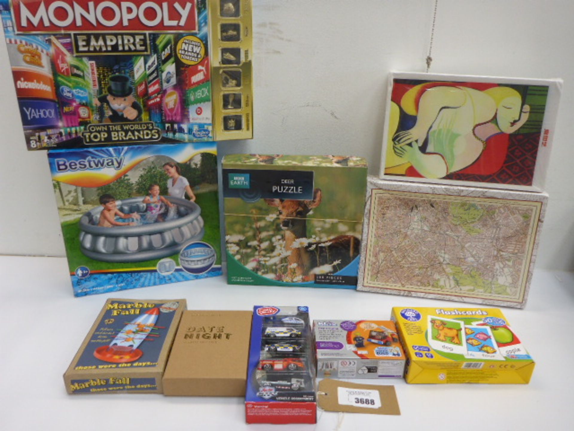 10 boxed games including Monopoly Empire, Marble Fall, jigsaws, Bestway garden pool etc