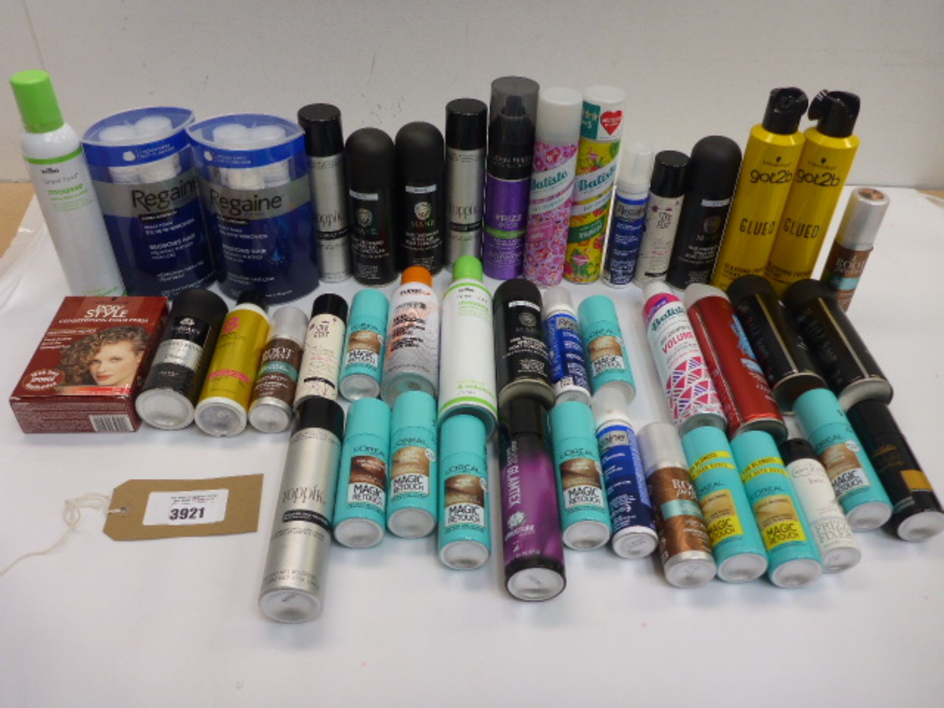 Selection of hair products including dry shampoo, Regaine treatments, blasting freeze, colourants,