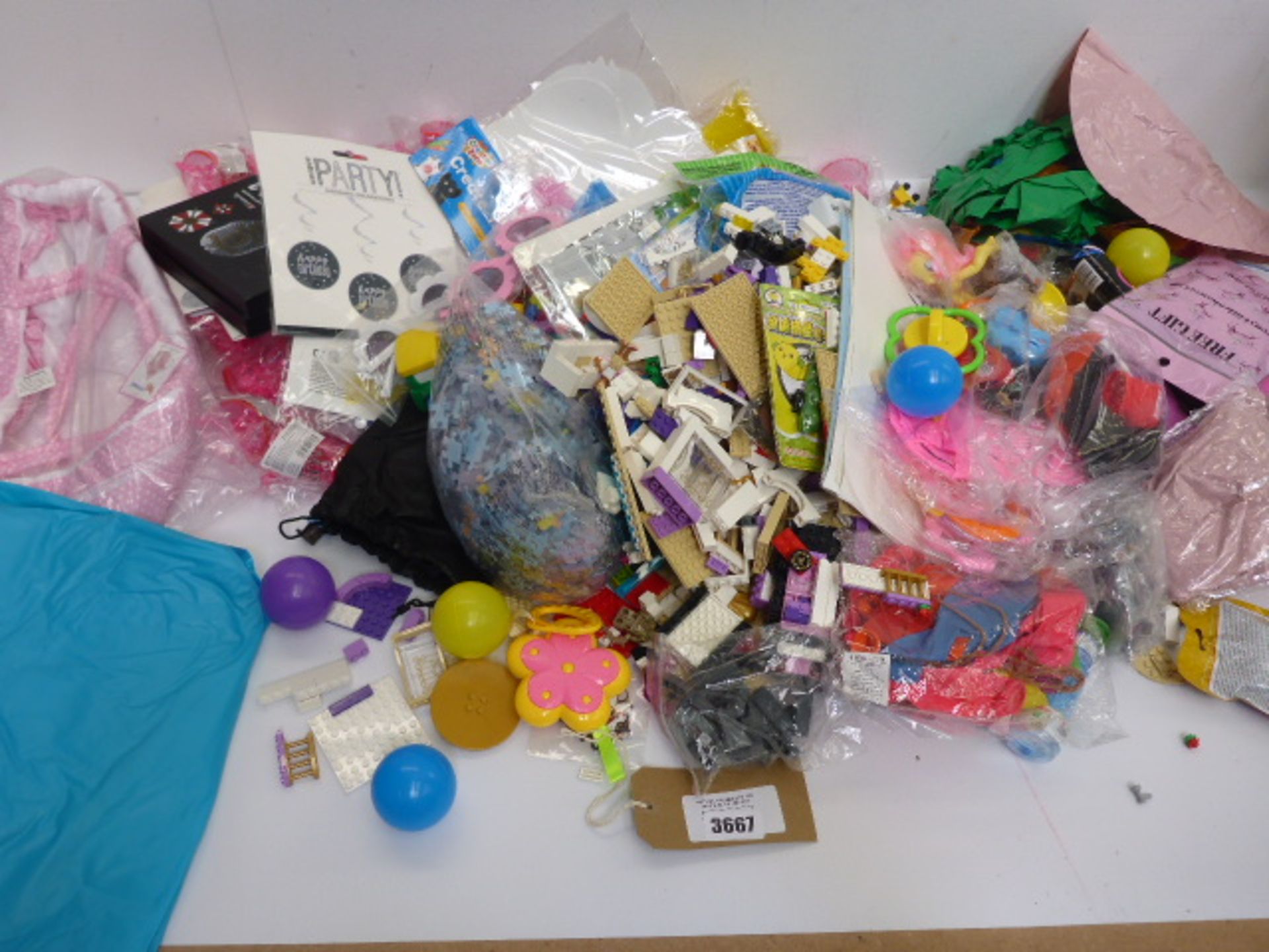 Large bag of novelty toys, inflatables, stickers, loose building bricks, puzzle etc