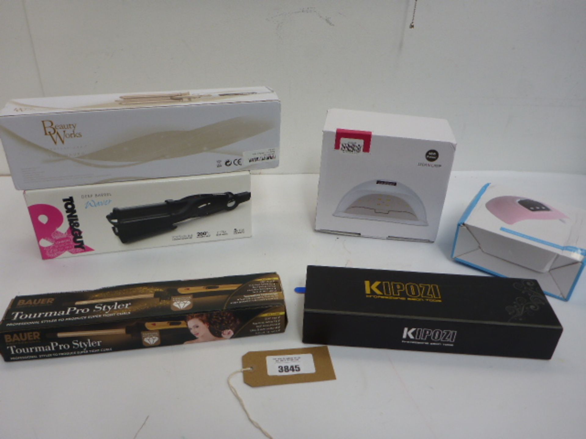 Tony & Guy deep barrel waver, Beauty Works waver and 2 other stylers together with 2 LED/UV lamps