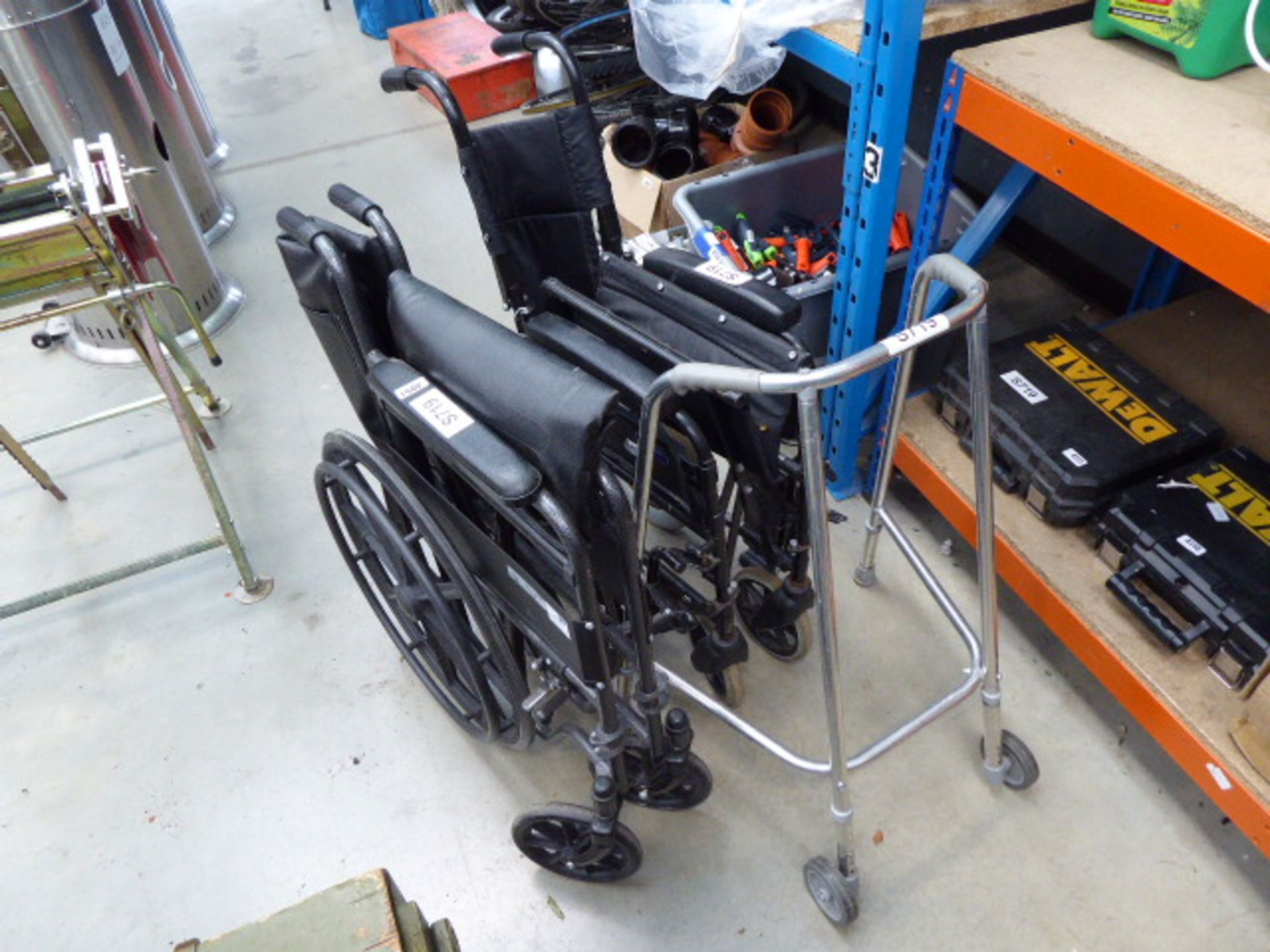 2 folding wheelchairs and a walking frame